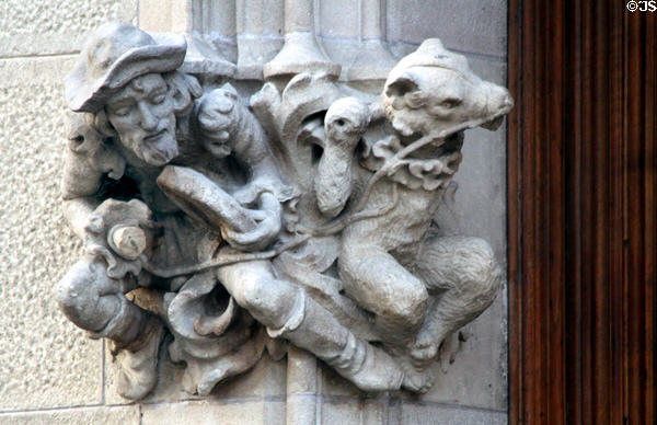 Carved man with performing bear on Casa Amatller. Barcelona, Spain.