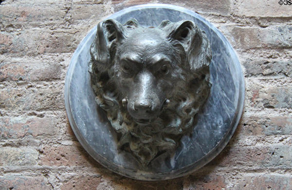 Dog medallion on wall of horse stables under Palau Güell. Barcelona, Spain.