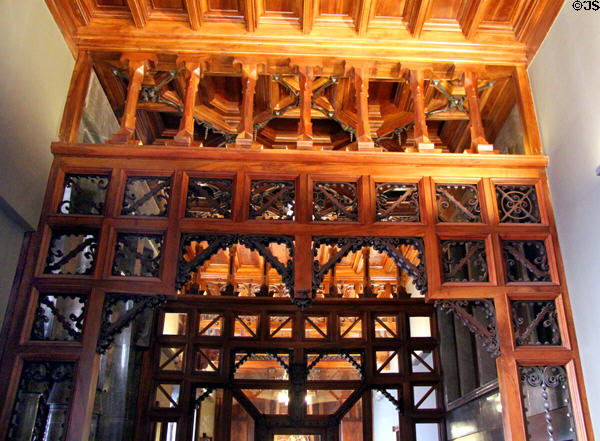 Wooden screen dividing rear hall into parlor & dining areas at Palau Güell. Barcelona, Spain.