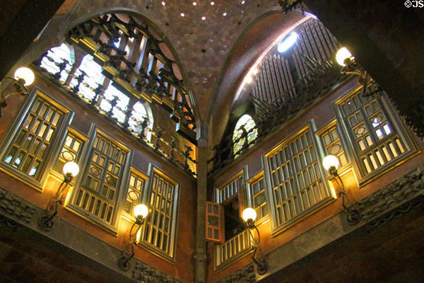 Windows & organ pipes overlooking central hall at Palau Güell. Barcelona, Spain.