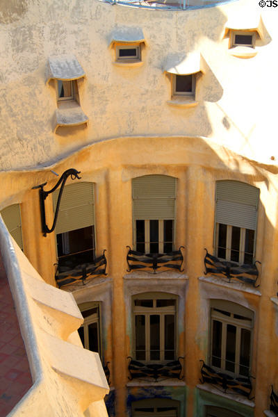 Central courtyard well windows seen from roof of Casa Milà. Barcelona, Spain.
