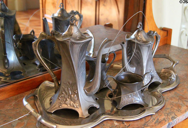 Art Nouveau coffee service in dining room of museum apartment at Casa Milà. Barcelona, Spain.