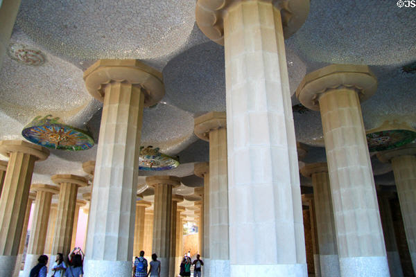 Neoclassical columns of Sala Hipóstila (Hypostyle Hall) which support the plaza roof in Parc Güell. Barcelona, Spain. Architect: Antoni Gaudí.