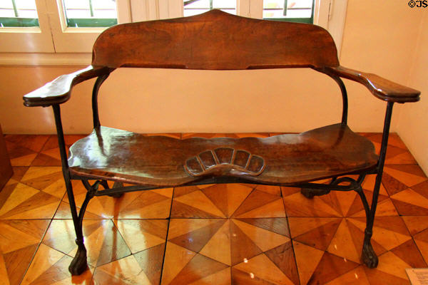 Modernista bench (1908-14) designed for Crypt of Colonia Güell in Santa Coloma de Cervelló by Antoni Gaudí at Gaudi House Museum in Parc Güell. Barcelona, Spain.
