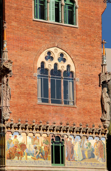 Gothic facade & mosaic mural at Hospital de Sant Pau. Barcelona, Spain.