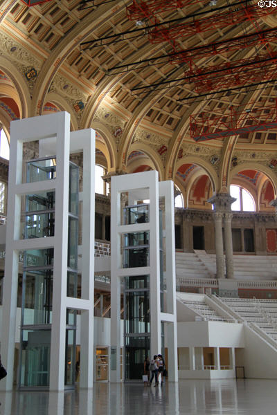 Museum elevator shafts plus performance seating in oval room of Palau Nacional. Barcelona, Spain.