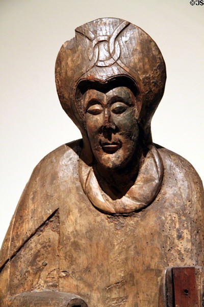 Wood carving of figure from church of Nativity of Mary of Durro (12th C) at Museu Nacional d'Art de Catalunya. Barcelona, Spain.