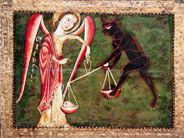 Altar painting (13th C) detail of the Archangel Michael battling devil for souls from church of Catalunya at Museu Nacional d'Art de Catalunya. Barcelona, Spain.