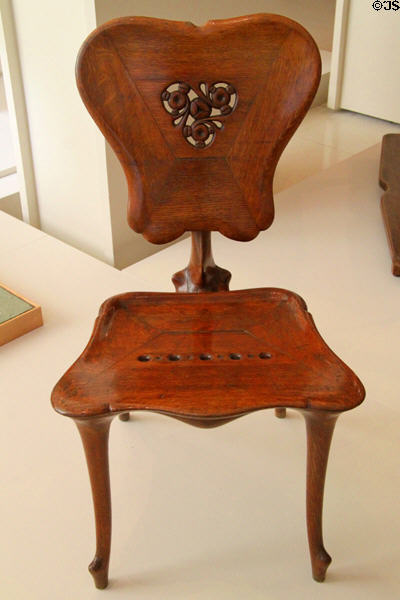 Modernista chair (c1900) from Casa Calvet in Barcelona by Antoni Gaudí at Museu Nacional d'Art de Catalunya. Barcelona, Spain.