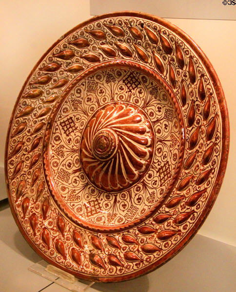 Plate with rows of leaves in relief (16thC) at Ceramics Museum of Barcelona. Barcelona, Spain.