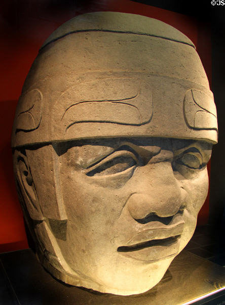 Copy of Olmec head from Mexico in window of Barbier Mueller Precolumbian Art Museum (Museu Barbier-Mueller d'Art Precolombí). Barcelona, Spain.