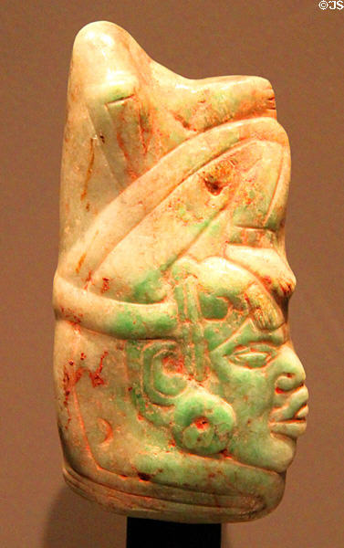 Acrobat jade pendant (500-900) from Maya Guatemala or Mexico at Barbier Mueller Precolumbian Art Museum. Barcelona, Spain.