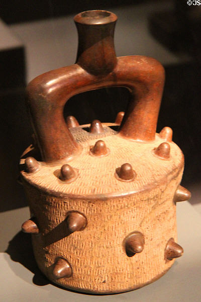 Ceramic stirrup-handle vessel (900-400 BCE) from Chavin Culture, Peru at Barbier Mueller Precolumbian Art Museum. Barcelona, Spain.