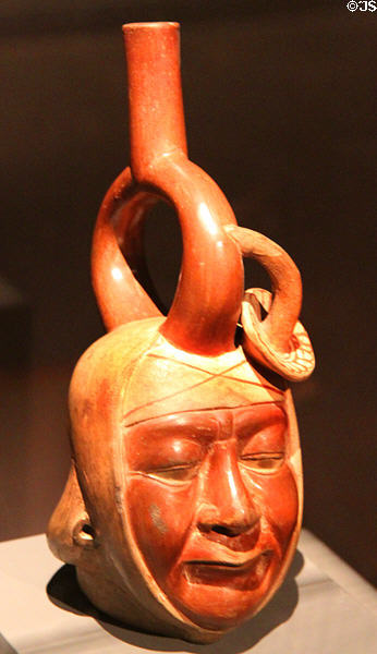 Ceramic stirrup-handle portrait vessel (100 BCE-600 CE) from Mochica Culture, Peru at Barbier Mueller Precolumbian Art Museum. Barcelona, Spain.