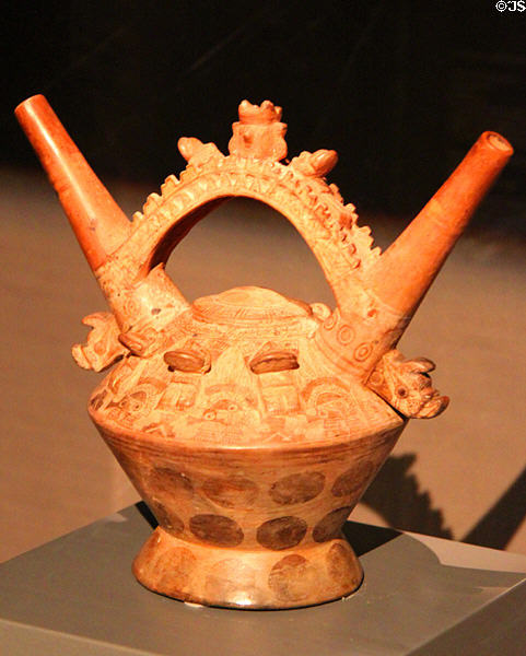 Ceramic double-spouted bridge-handle vessel (1100-1200) from Lambayeque Culture, Peru at Barbier Mueller Precolumbian Art Museum. Barcelona, Spain.