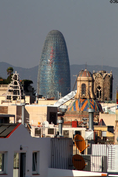 Torre Agbar seen over ancient towers of downtown Barcelona. Barcelona, Spain.
