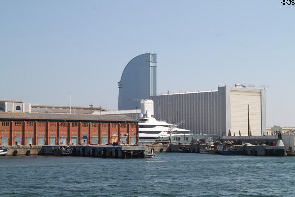 Yacht shipyard with curved W Hotel beyond. Barcelona, Spain.