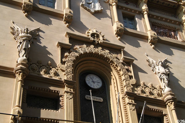 Facade of Poliorama Theatre (La Rambla 115) with clock (1891) which marks official time of Barcelona. Barcelona, Spain.