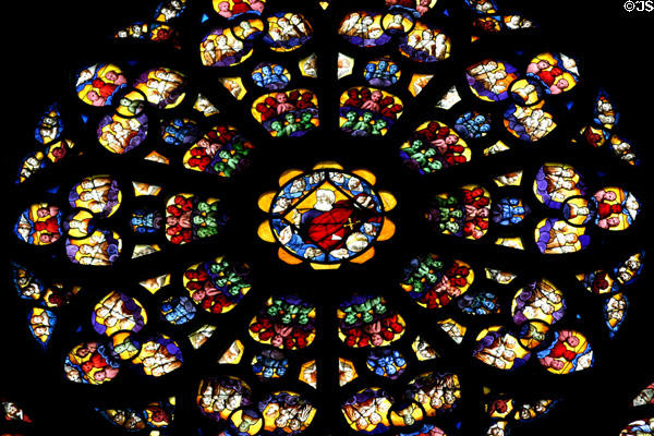 Stained glass rose window of God the Father with angels (1550) in Cathedral St Étienne. Auxerre, France.