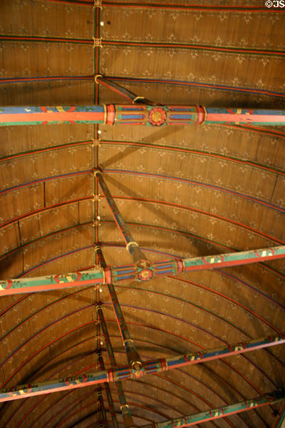 Great hall of the poor vaulted painted beams ceiling in Hotel Dieu. Beaune, France.