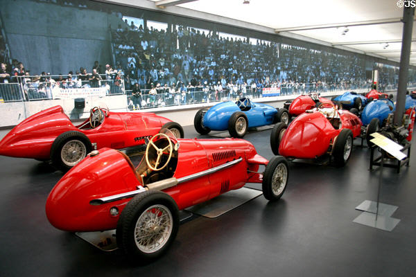 Historic racing cars lined in front of fans in Schlumpf National Automobile Museum. Mulhouse, France.
