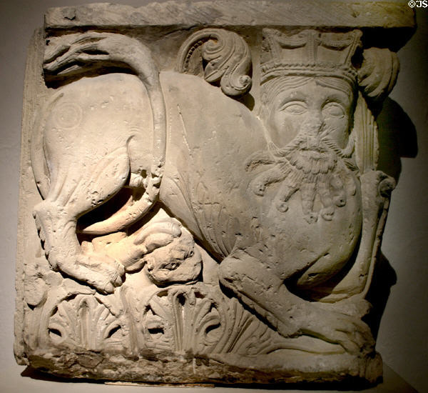 Bas-relief carving in Persian style (c1150) from Picheny Abbey of crowned bearded man with lion's body in Fontenay Abbey museum. Fontenay, France.
