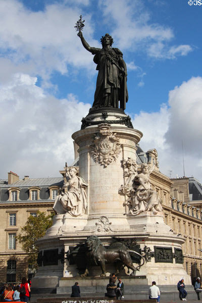 Bronze Marianne symbol of France atop carved monument (1883) representing liberty, equality, & fraternity over lion guarding ballot box by Charles & Léopold Morice at Place de la République. Paris, France.