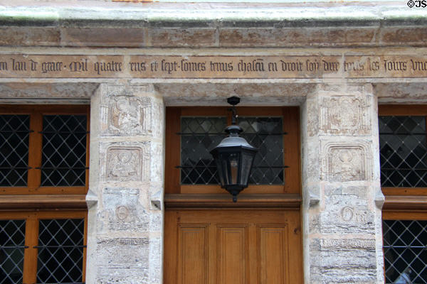 Sayings & carvings of angels surround doorway at Nicolas Flamel house (1407). Paris, France.