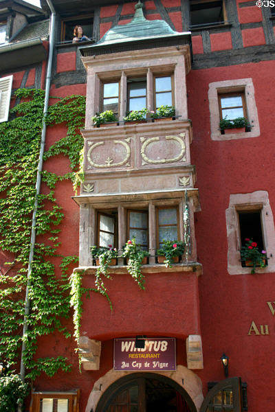 Half-timbered & stone Winstub show former German ownership of Alsace. Riquewihr, France.