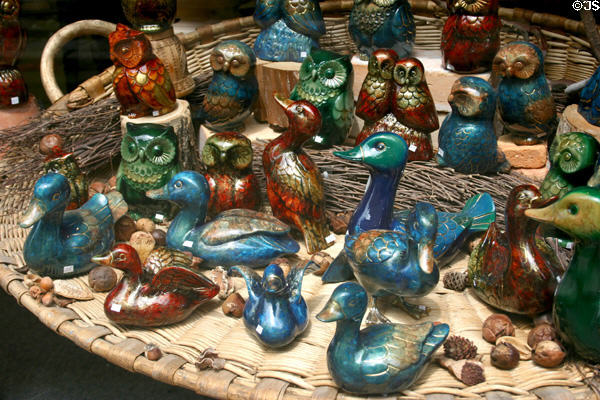 Pottery ducks & owls in shop window. Vézelay, France.