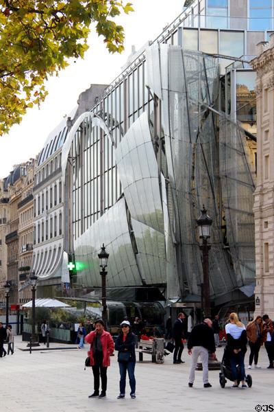 Drugstore Publicis curved glass facade (2001-4) on Champs Elysees. Paris, France. Architect: Building Inc. Los Angeles.