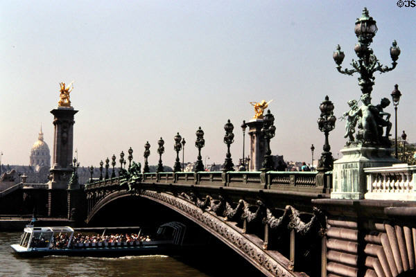 Alexandre III bridge built for 1900 World Exposition as a single span steel arch plus Les Invalides beyond. Paris, France. Style: Art Nouveau.