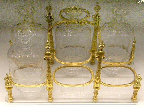 Liquor bottles in gilded bronze frame by Baccarat (shown Paris Expo 1878) at Museum of Decorative Arts. Paris, France.