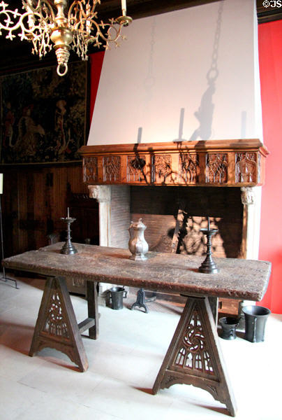 Oak trestle table (1473-8) in room with 15thC fireplace & objects at Museum of Decorative Arts. Paris, France.