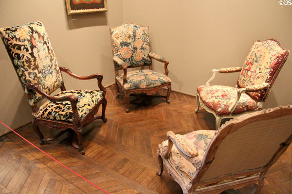 Armchairs (1700s) upholstered with tapestries at Museum of Decorative Arts. Paris, France.