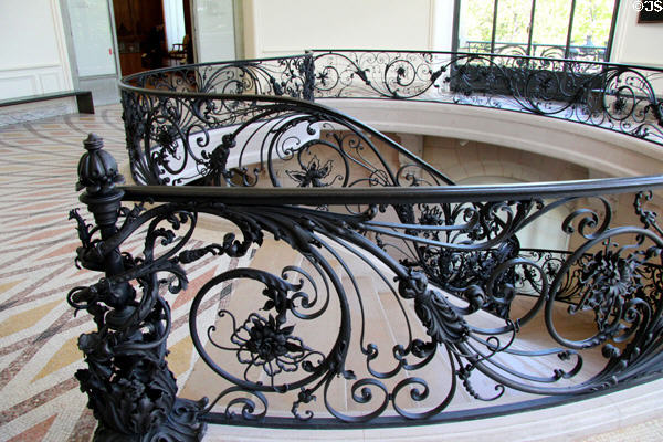 Art Nouveau iron banister of spiral staircase at Petit Palace Museum. Paris, France.