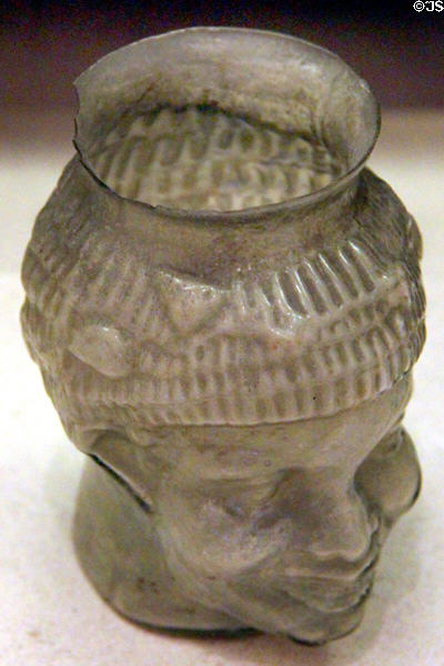 Mold blown glass goblet in form of smiling African (1stC CE) prob. from Sidon in Phoenicia at Petit Palace Museum. Paris, France.