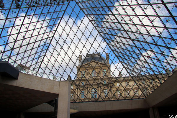 View out from glass pyramid at Louvre Museum. Paris, France.