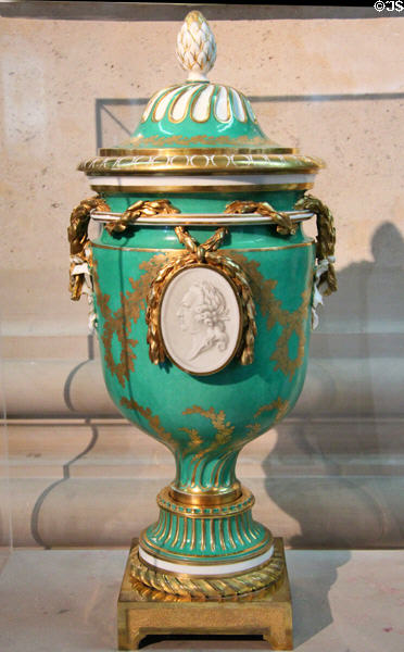 Sèvres porcelain flame vase (after flame-pattern handle atop lid) (c1771) by Jean Baptiste Etienne Genest, et al with profile of Louis XV at Sèvres National Ceramic Museum. Paris, France.