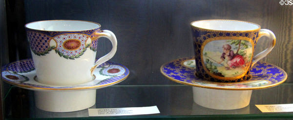 Sèvres porcelain cups & saucers (l) (1765) by Méreaud l'aîné & (r) (1766) by de Cornailles at Sèvres National Ceramic Museum. Paris, France.