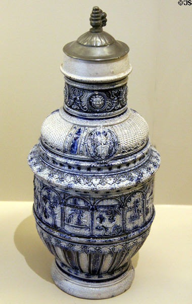 Blue & gray stoneware jug with arms of electors of Holy Roman Empire (c1575) from Raëren, Germany at Sèvres National Ceramic Museum. Paris, France.