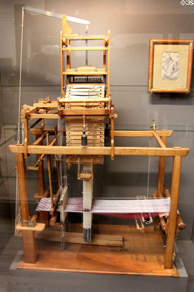 Model of loom programmed via punch cards (c1810) invented by Joseph-Marie Jacquard at Arts et Metiers Museum. Paris, France.