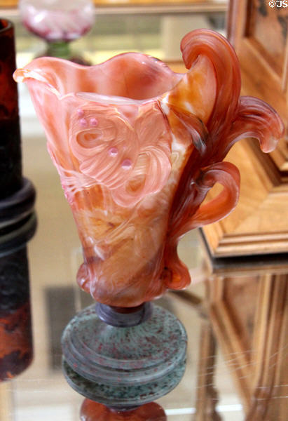 Art Nouveau pink glass pitcher with freeform flower handle by Émile Gallé at Arts et Metiers Museum. Paris, France.