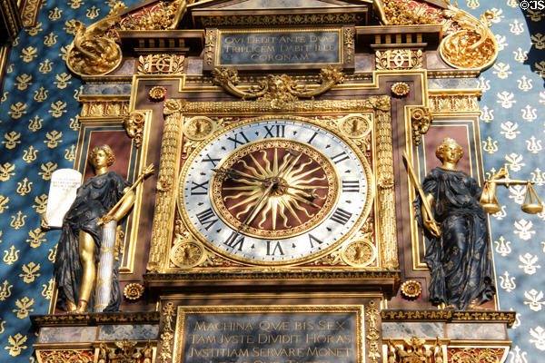 Detail of face of first public clock in Paris carved by Germain Pilon (16thC) at Conciergerie. Paris, France.
