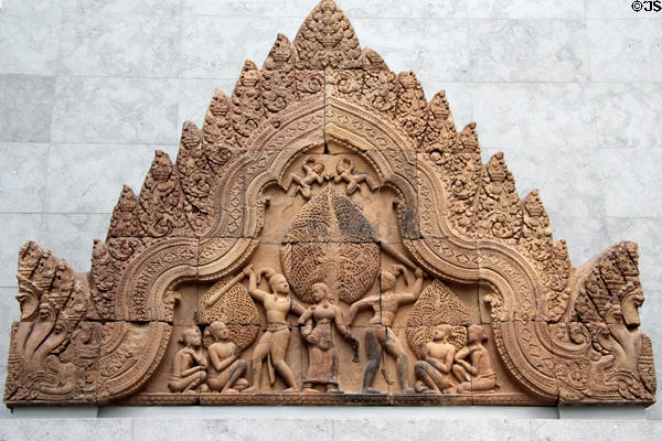Cambodian pediment with men fighting over woman from Banteay Srei at Guimet Museum. Paris, France.