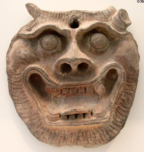 Chinese terra cotta mask (1st-3rdC CE - Han dynasty) at Guimet Museum. Paris, France.