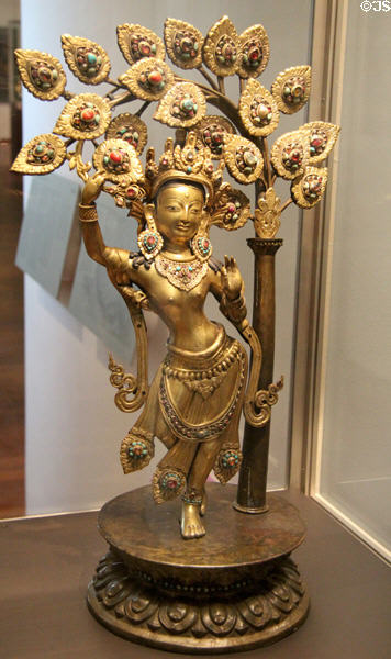 Gilded copper statue with gems of queen Maya Devi (19thC) from Nepal at Guimet Museum. Paris, France.