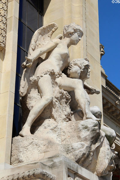 Winged figure sculpted on Grand Palais. Paris, France.