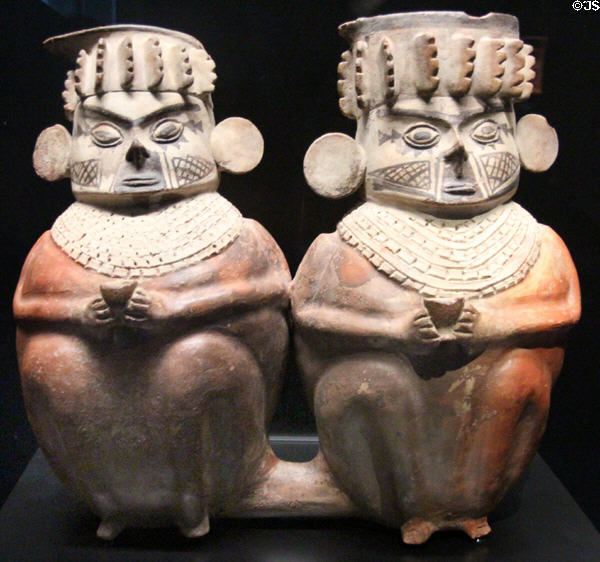 Chancay culture terra cotta funerary vases of seated couple (1100 - 1450) from Peru at Musée du quai Branly. Paris, France.