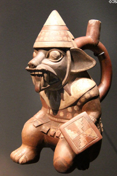 Mochika culture terra cotta stirrup bottle in form of fox dressed as warrior (100 BCE - 700 CE) from Peru at Musée du quai Branly. Paris, France.